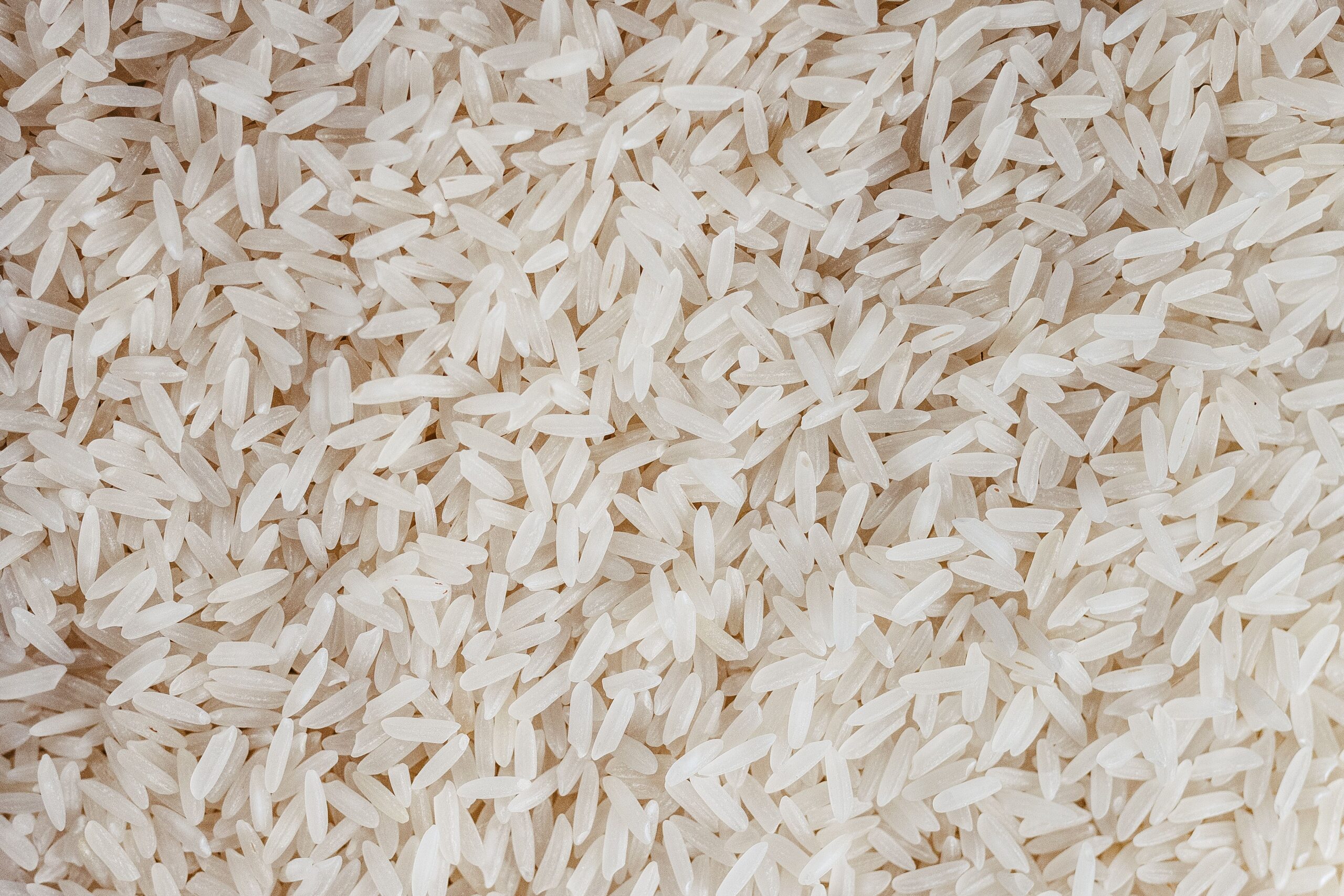 pexels photo 36346844 36346844 Detailed texture of uncooked white rice grains, perfect for food-related content.